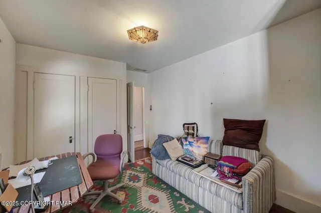 a bathroom with a toilet a sink and a window