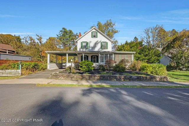 a living room with furniture a window and a fireplace