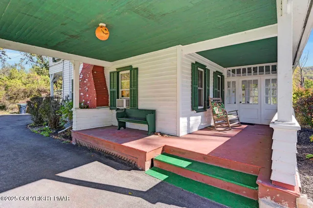 a living room with furniture a rug and a fireplace