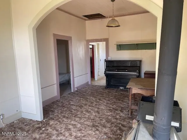 a living room with a couch and a walk in closet