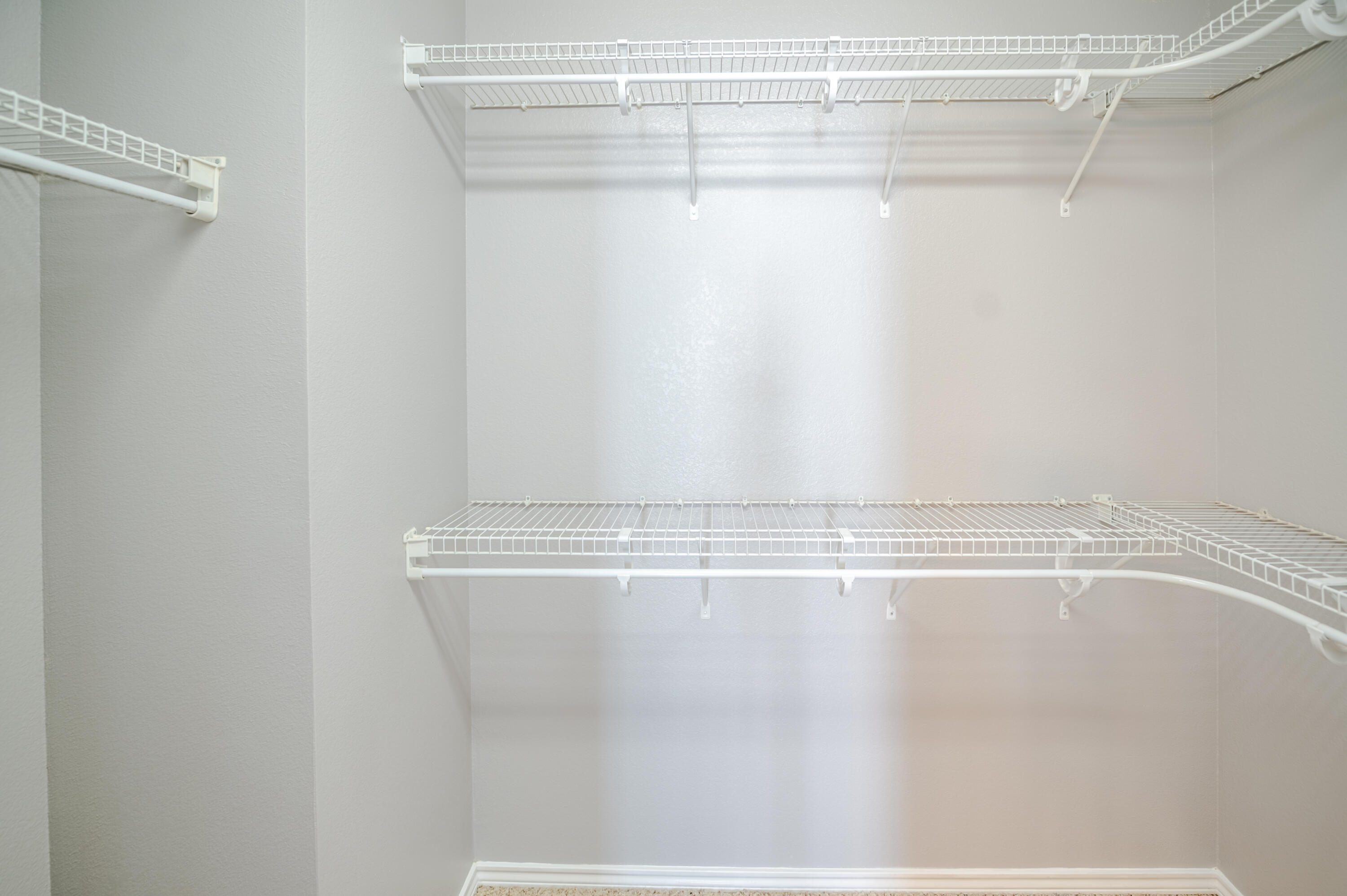 2111 Main Street, Unit 1 Lubbock, TX 79401 - Photo 23 of 36 a view of a room with racks on the wall