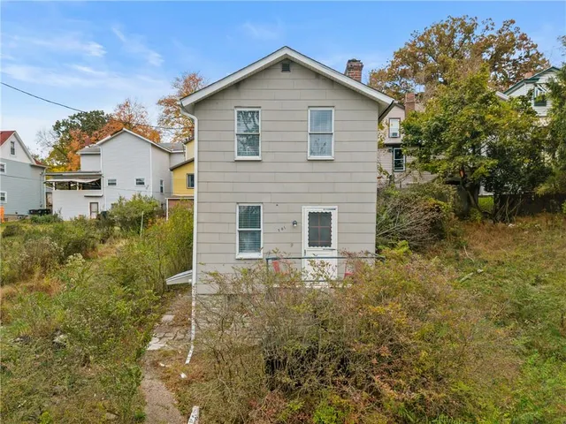 a view of a backyard of the house