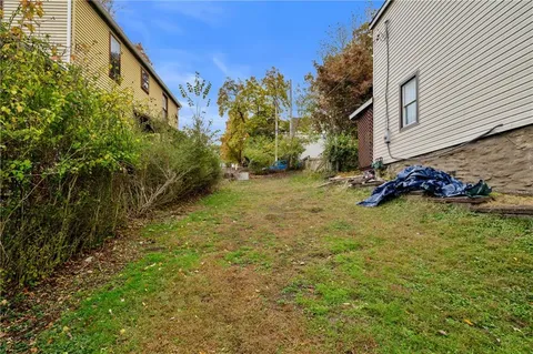 a backyard of a house with lots of green space