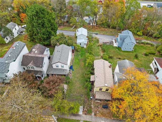an aerial view of a house with outdoor space and street view