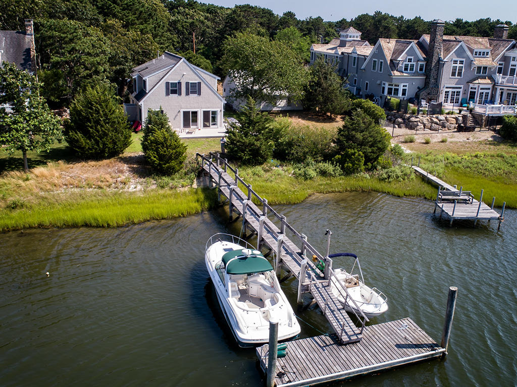 aerial view of a house with swimming pool and patio