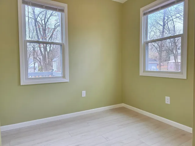 a view of empty room with windows