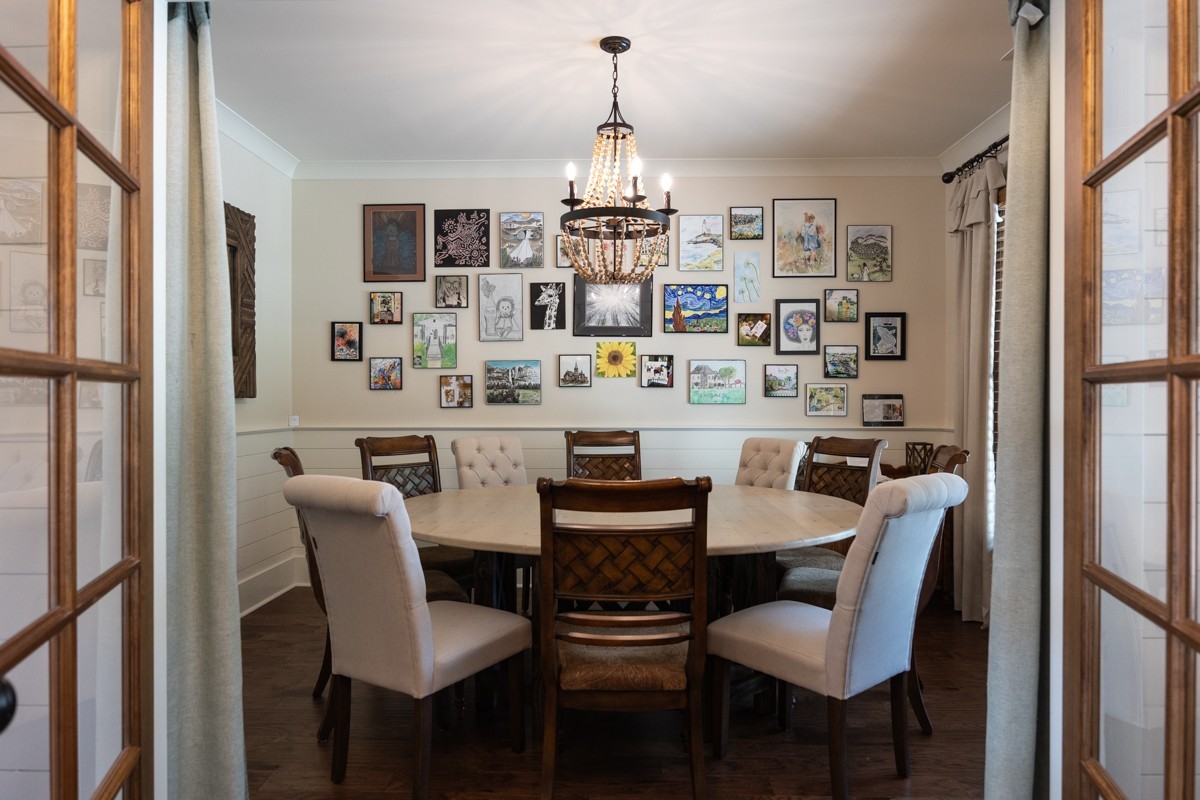 793 Davis Road Rogersville, AL 35652 - Photo 13 of 48 a dining room with furniture a chandelier and wooden floor