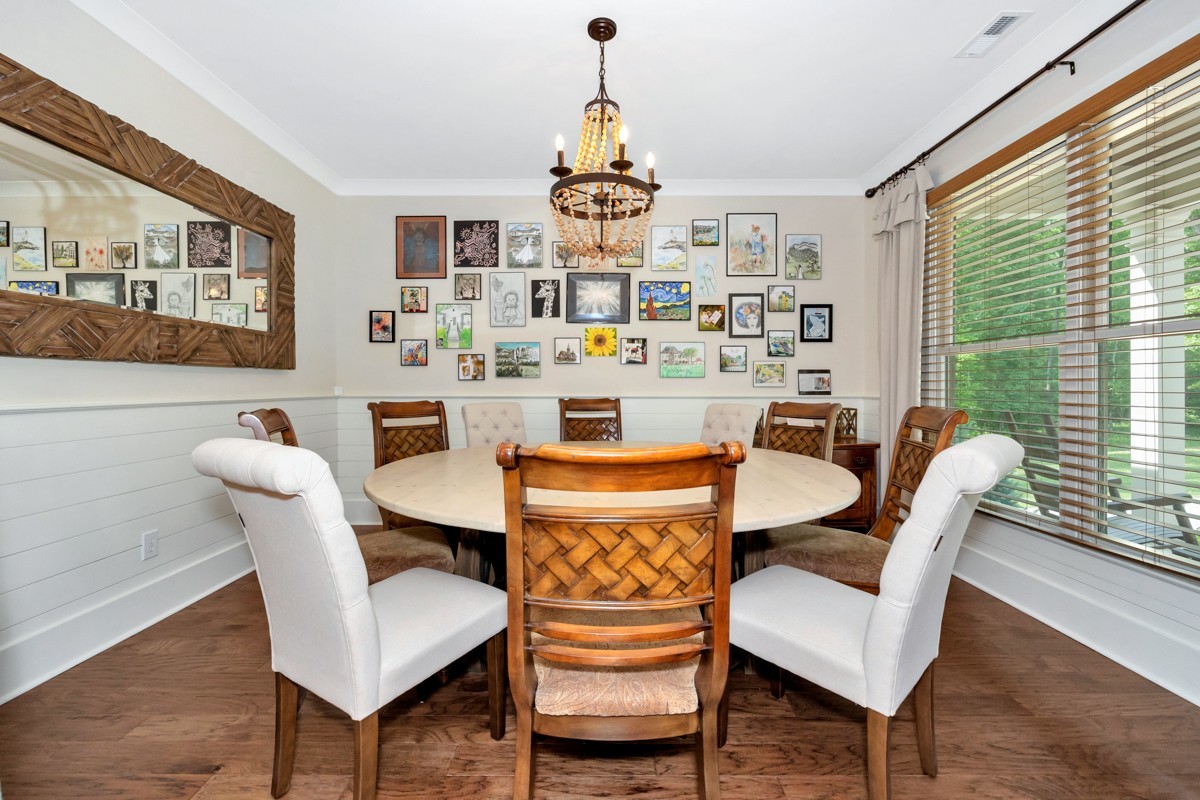 793 Davis Road Rogersville, AL 35652 - Photo 17 of 48 a dining room with furniture a chandelier and wooden floor