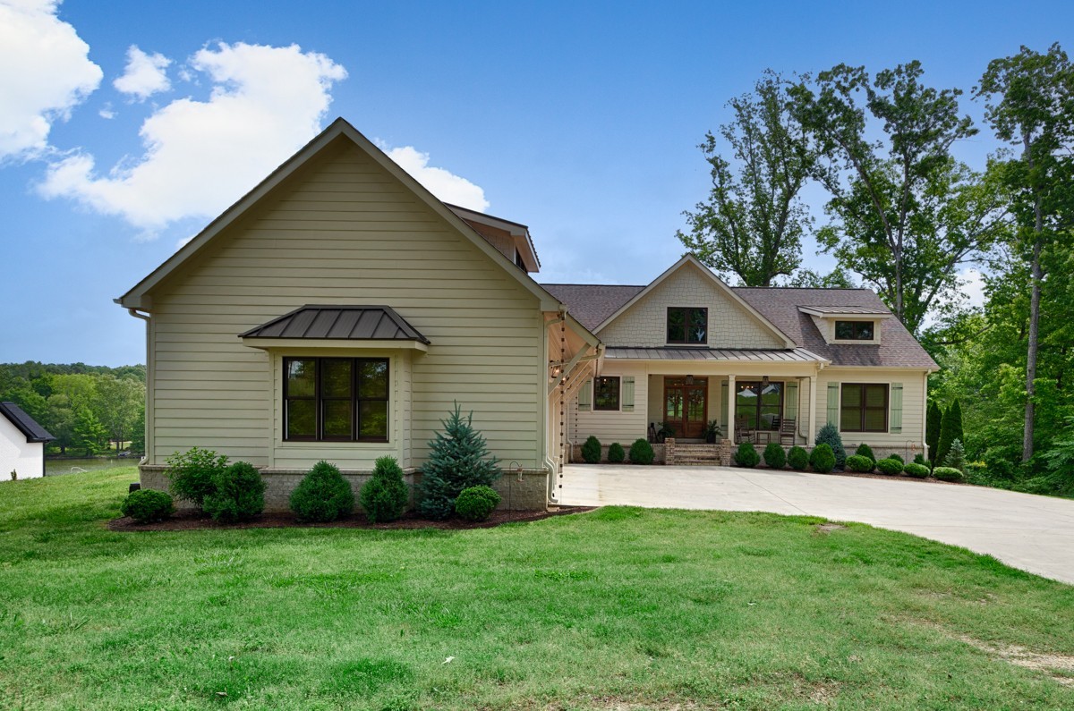 793 Davis Road Rogersville, AL 35652 - Photo 2 of 48 a front view of a house with a yard
