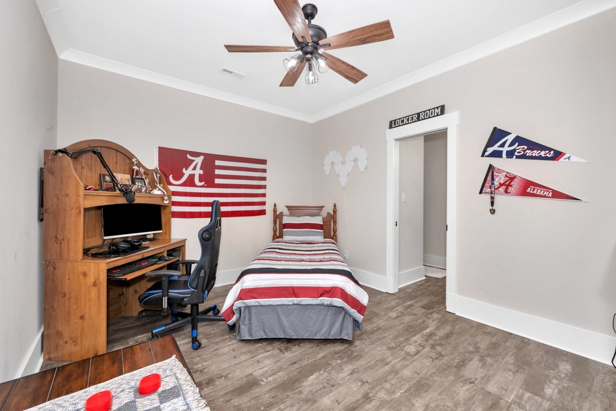 793 Davis Road Rogersville, AL 35652 - Photo 24 of 48 a bedroom with a bed and a chandelier