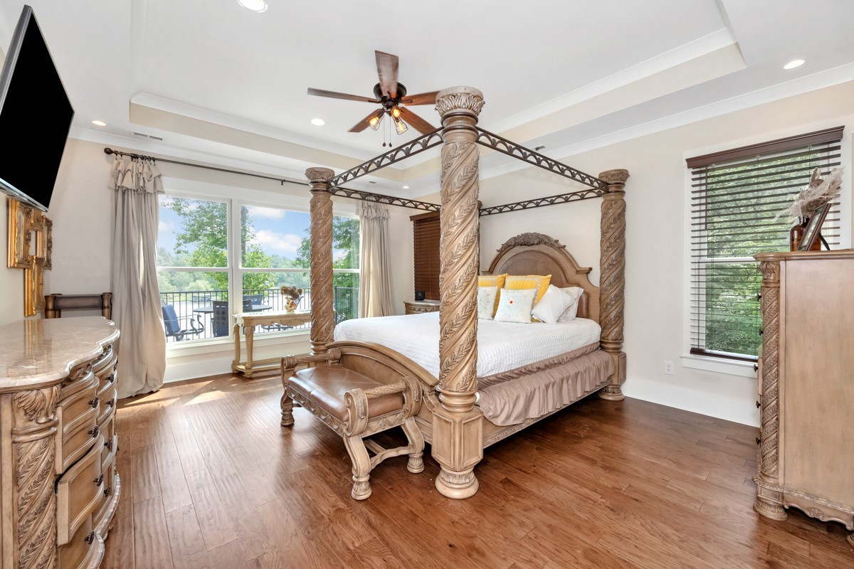 793 Davis Road Rogersville, AL 35652 - Photo 25 of 48 a bedroom with a bed a flat screen tv and a large window with the outer view