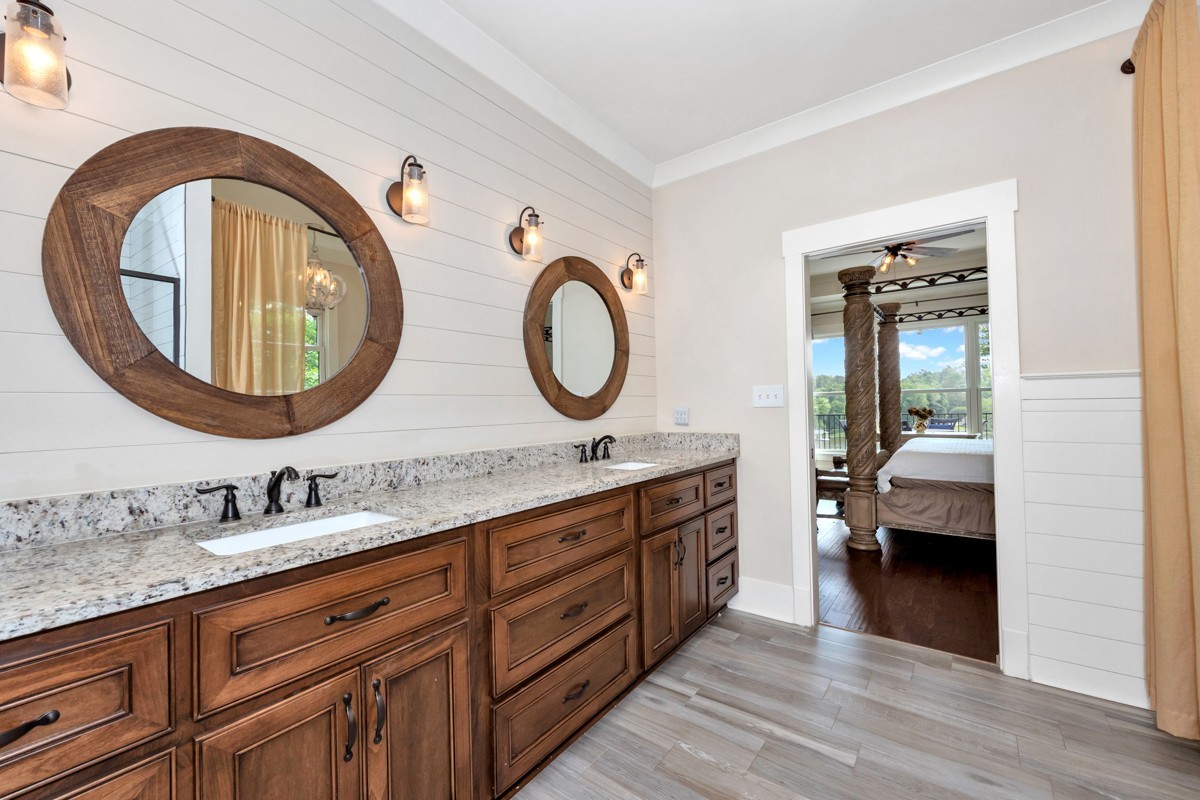 793 Davis Road Rogersville, AL 35652 - Photo 27 of 48 a bathroom with a granite countertop double vanity and a mirror