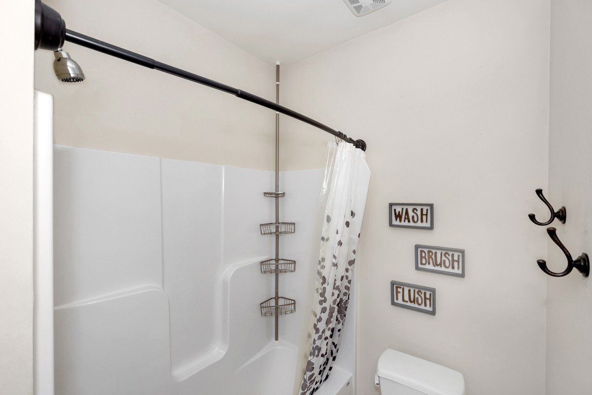 793 Davis Road Rogersville, AL 35652 - Photo 29 of 48 a bathroom with a shower and a toilet