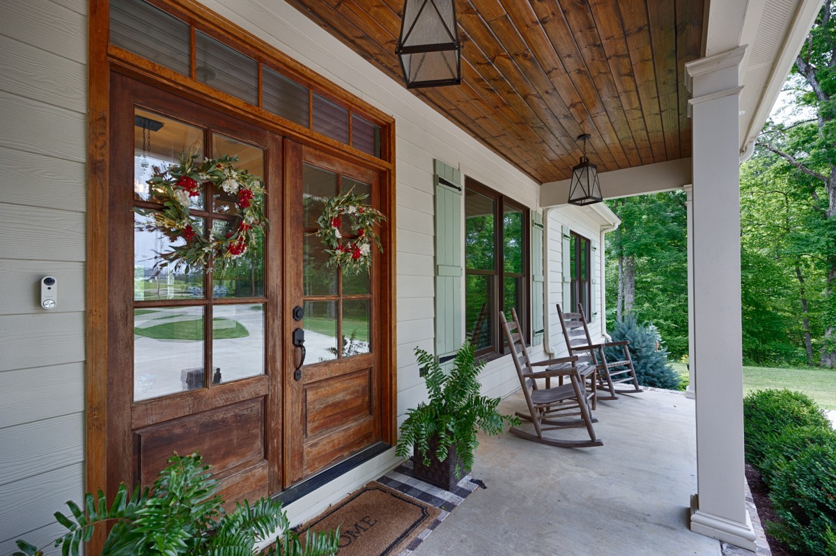 793 Davis Road Rogersville, AL 35652 - Photo 3 of 48 a view of a porch with chairs and floor to ceiling window