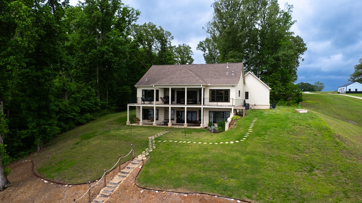793 Davis Road Rogersville, AL 35652 - Photo 37 of 48 a view of a house with a yard table and chairs