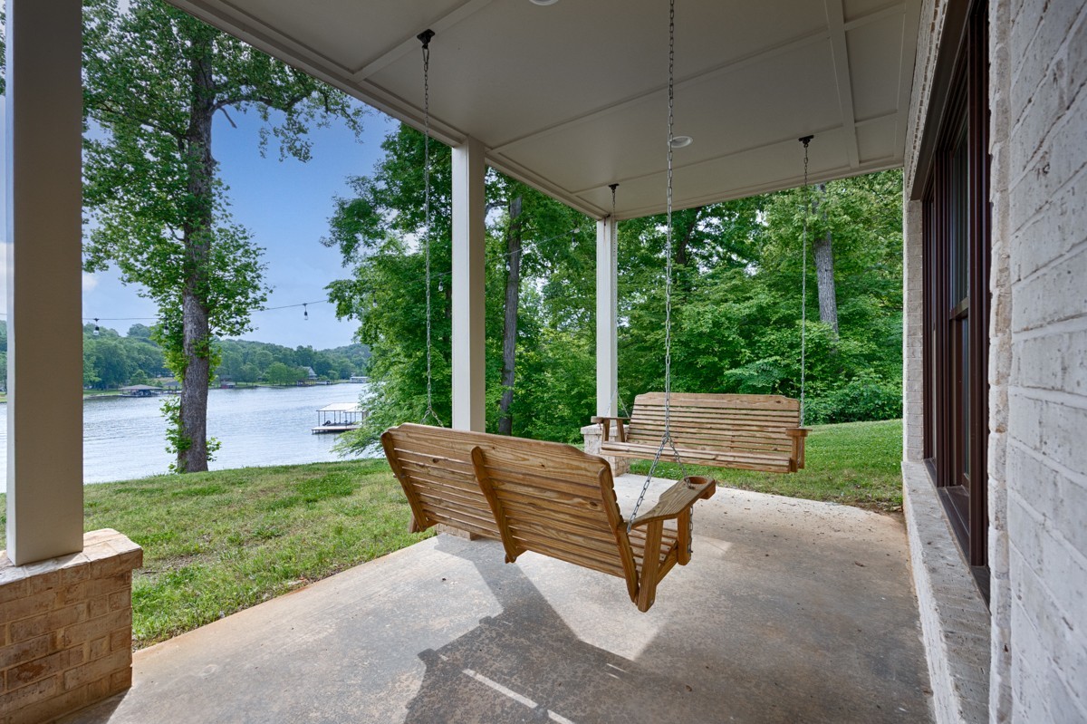 793 Davis Road Rogersville, AL 35652 - Photo 40 of 48 a view of a patio with a table chairs and a backyard
