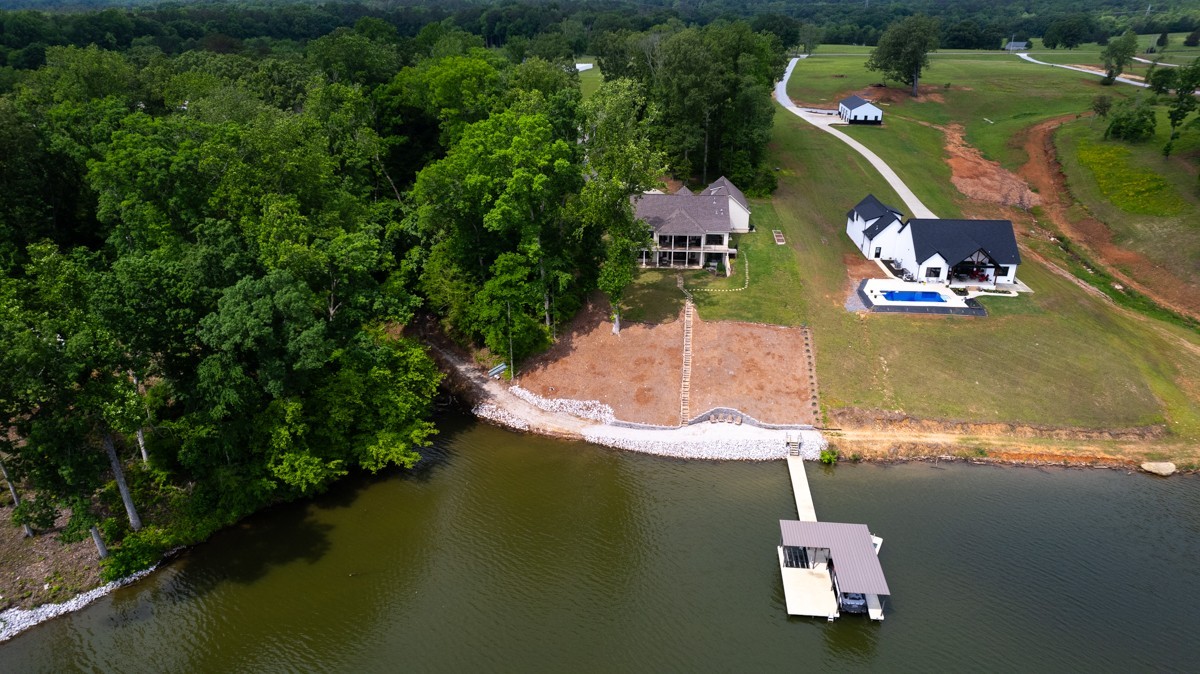 793 Davis Road Rogersville, AL 35652 - Photo 42 of 48 an aerial view of a house with a yard lake lake view and boat