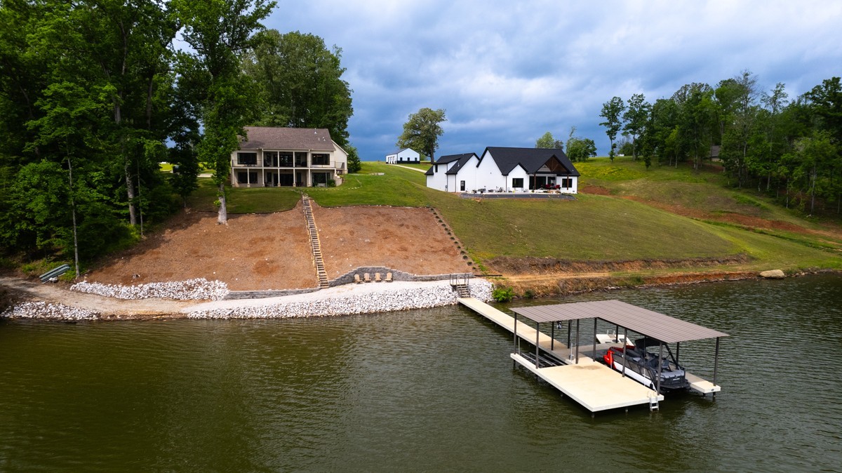 793 Davis Road Rogersville, AL 35652 - Photo 43 of 48 a view of a lake with house
