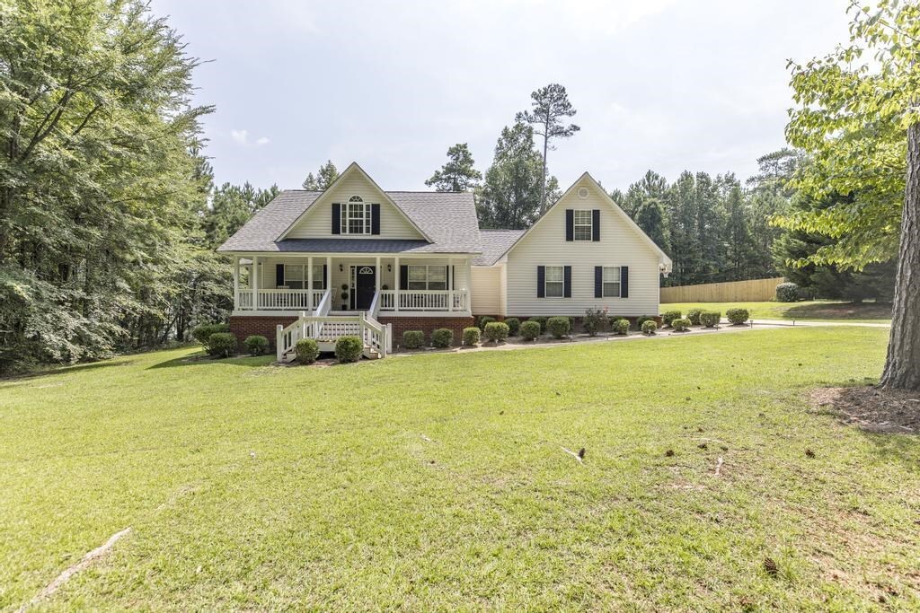 239 Lite-N-Tie Road Gray, GA 31032 - Photo 1 of 1 a front view of a house with a yard