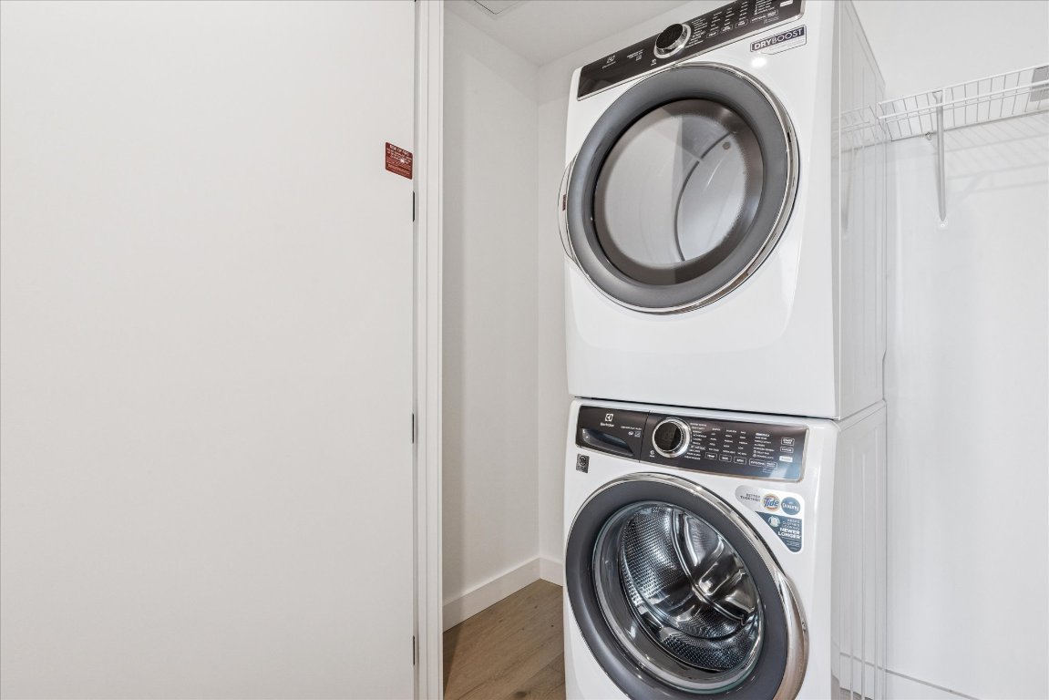 610 Davis Street, Unit 2201 Austin, TX 78701 - Photo 9 of 26 Washroom with stacked W/D