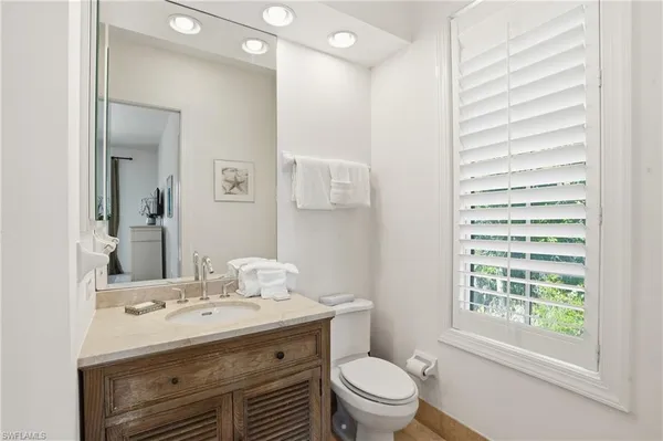 a view of an empty room with windows