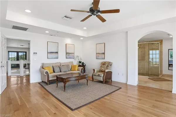 a view of a swimming pool with a table and chairs under an umbrella
