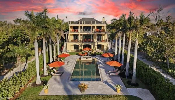 a view of entryway with livingroom and potted plant