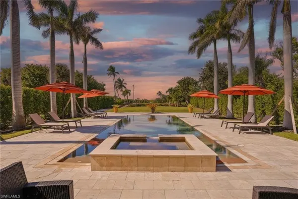 a living room with fireplace furniture and a flat screen tv