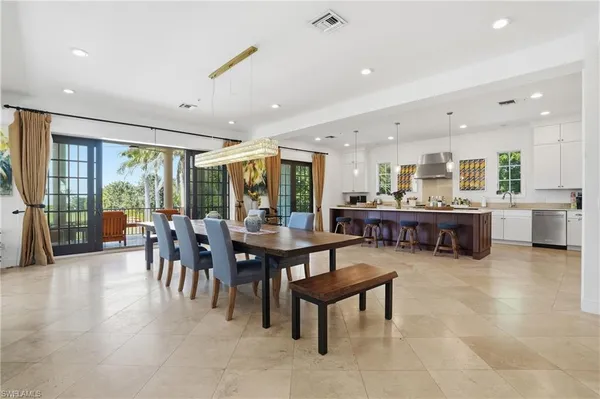 a living room with furniture and a large window with outer view