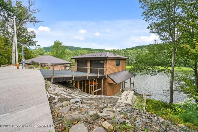 a house view with a sitting space and garden space