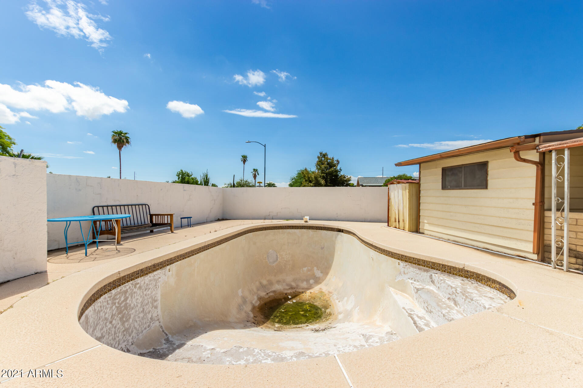 18835 North 25th Way Phoenix, AZ 85050 - Photo 23 of 24 a view of a swimming pool with a patio
