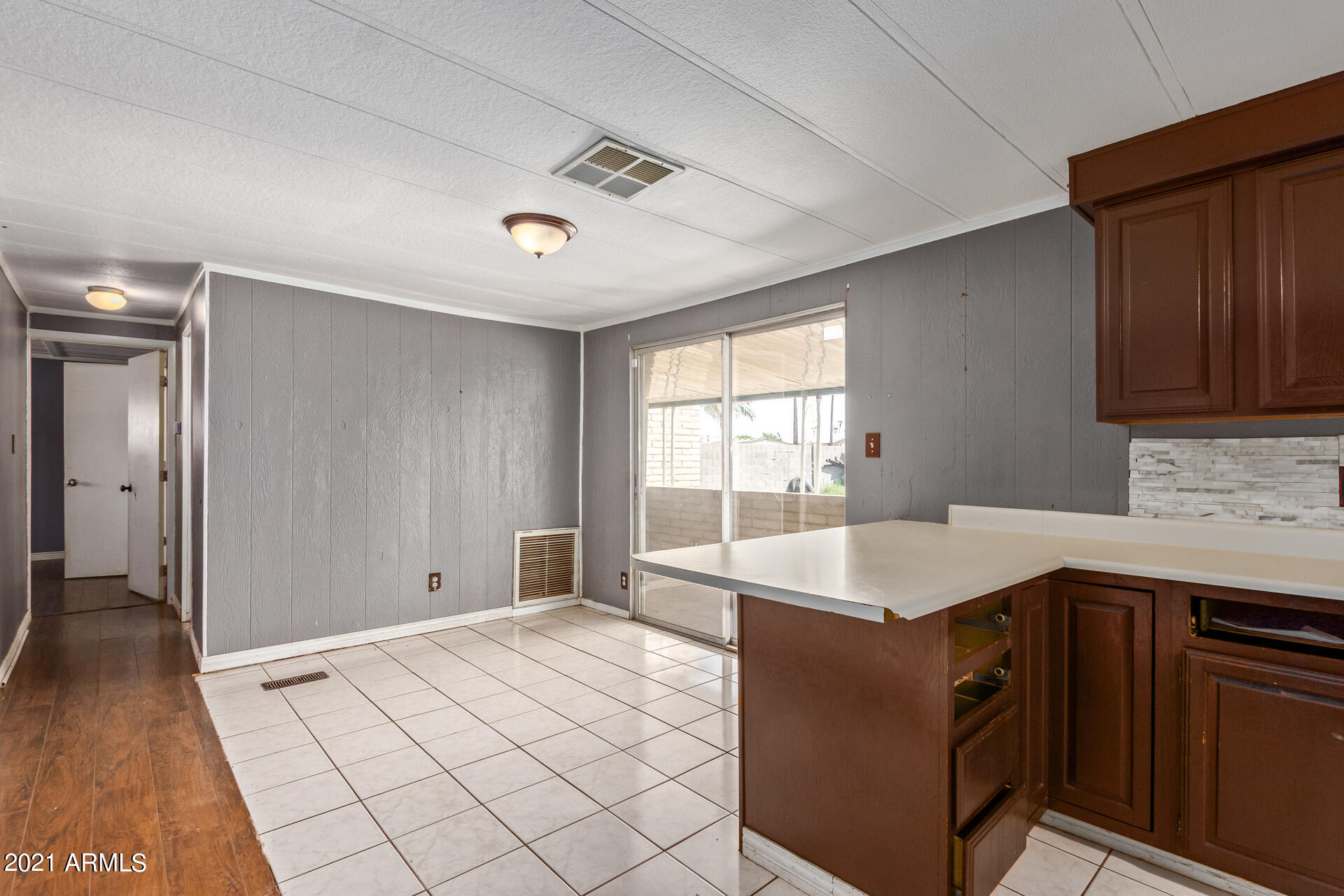 18835 North 25th Way Phoenix, AZ 85050 - Photo 7 of 24 a kitchen with a sink cabinets and window
