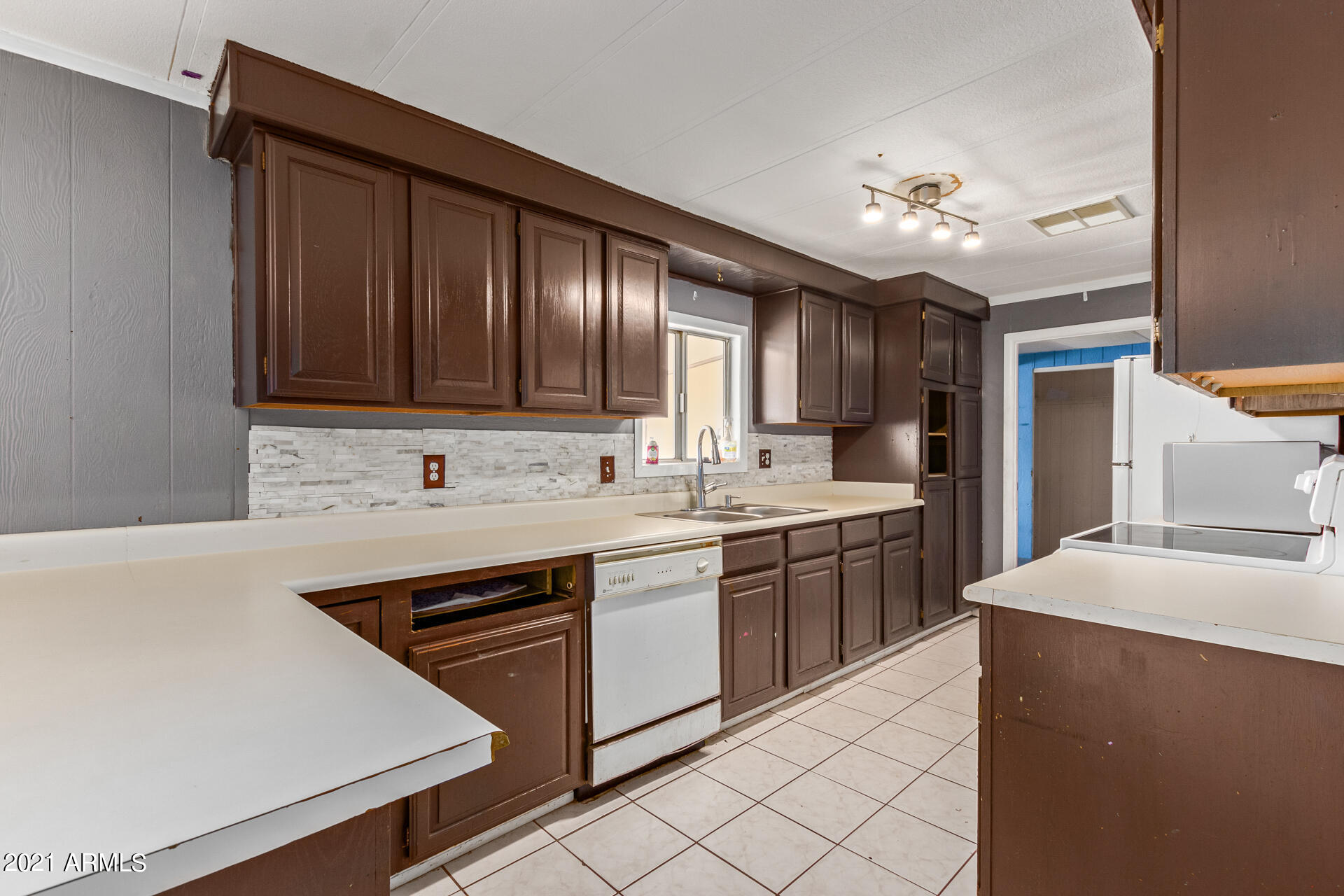 18835 North 25th Way Phoenix, AZ 85050 - Photo 8 of 24 a kitchen with stainless steel appliances granite countertop a sink stove and refrigerator