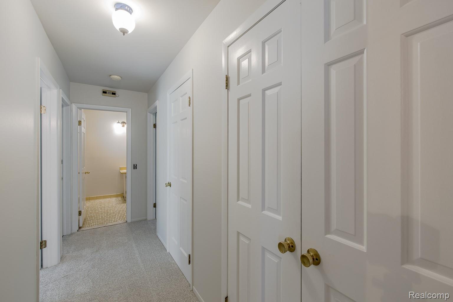 710 Basswood Drive Rochester, MI 48309 - Photo 25 of 42 Hall leading to bedrooms and full bathroom