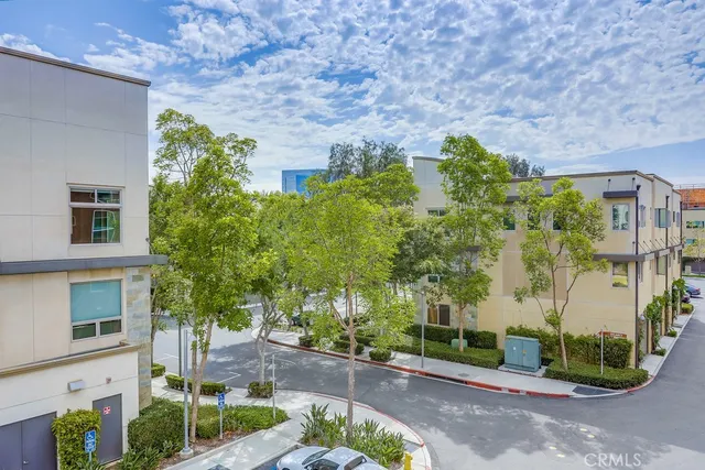 a view of balcony with wooden floor and fence