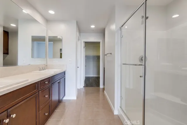 a bathroom with a shower and a sink