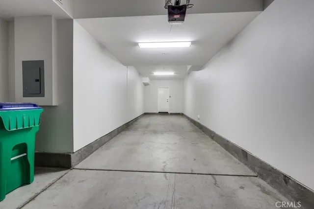 a front view of a house with a yard and potted plants
