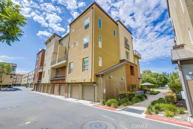 a outdoor living space with patio furniture and potted plants