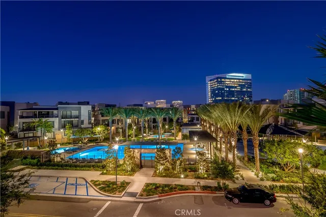 a view of a yard with plants and trees