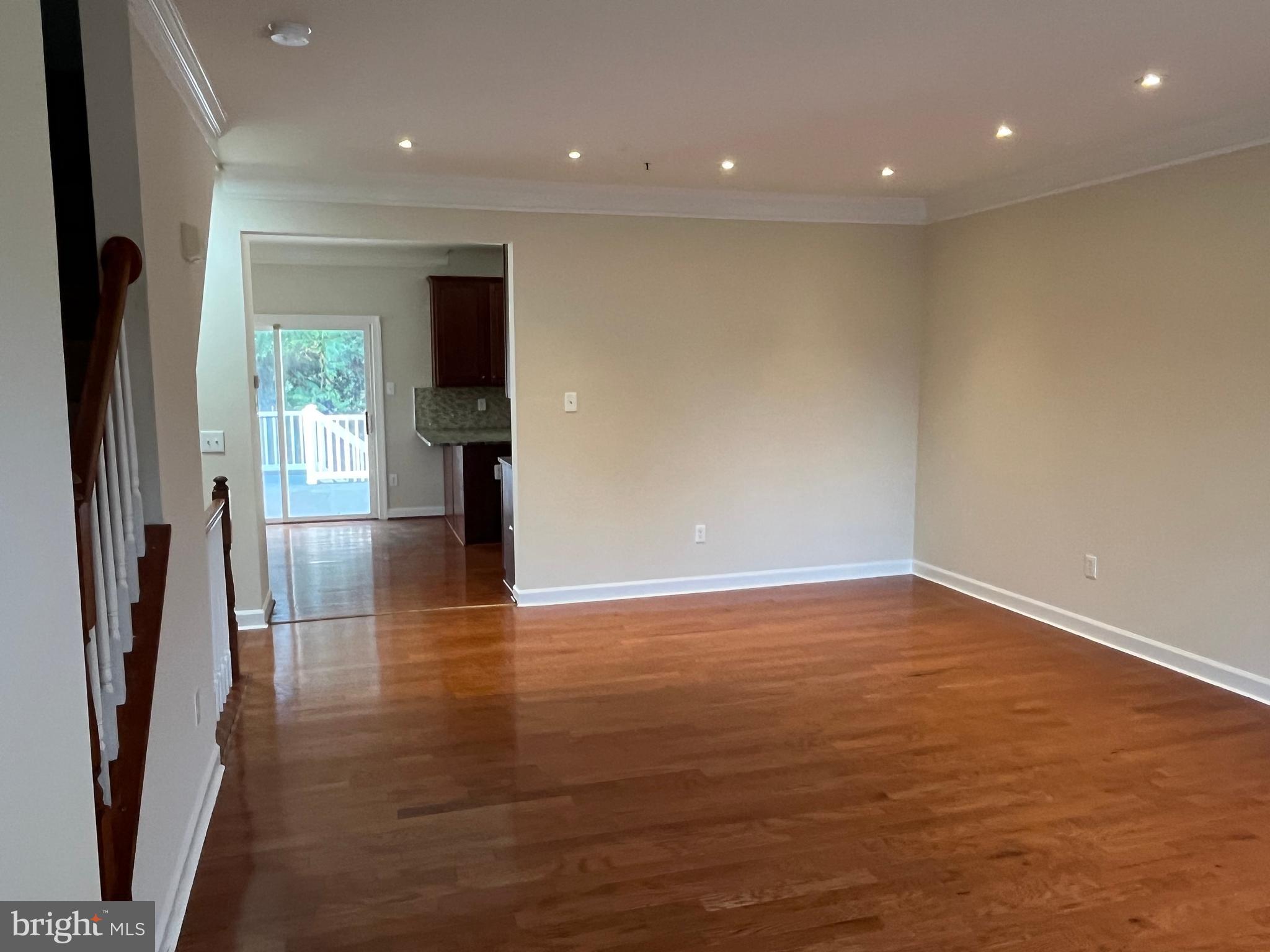3316 Castle Ridge Circle, Unit 16 Silver Spring, MD 20904 - Photo 15 of 71 an empty room with wooden floor and windows