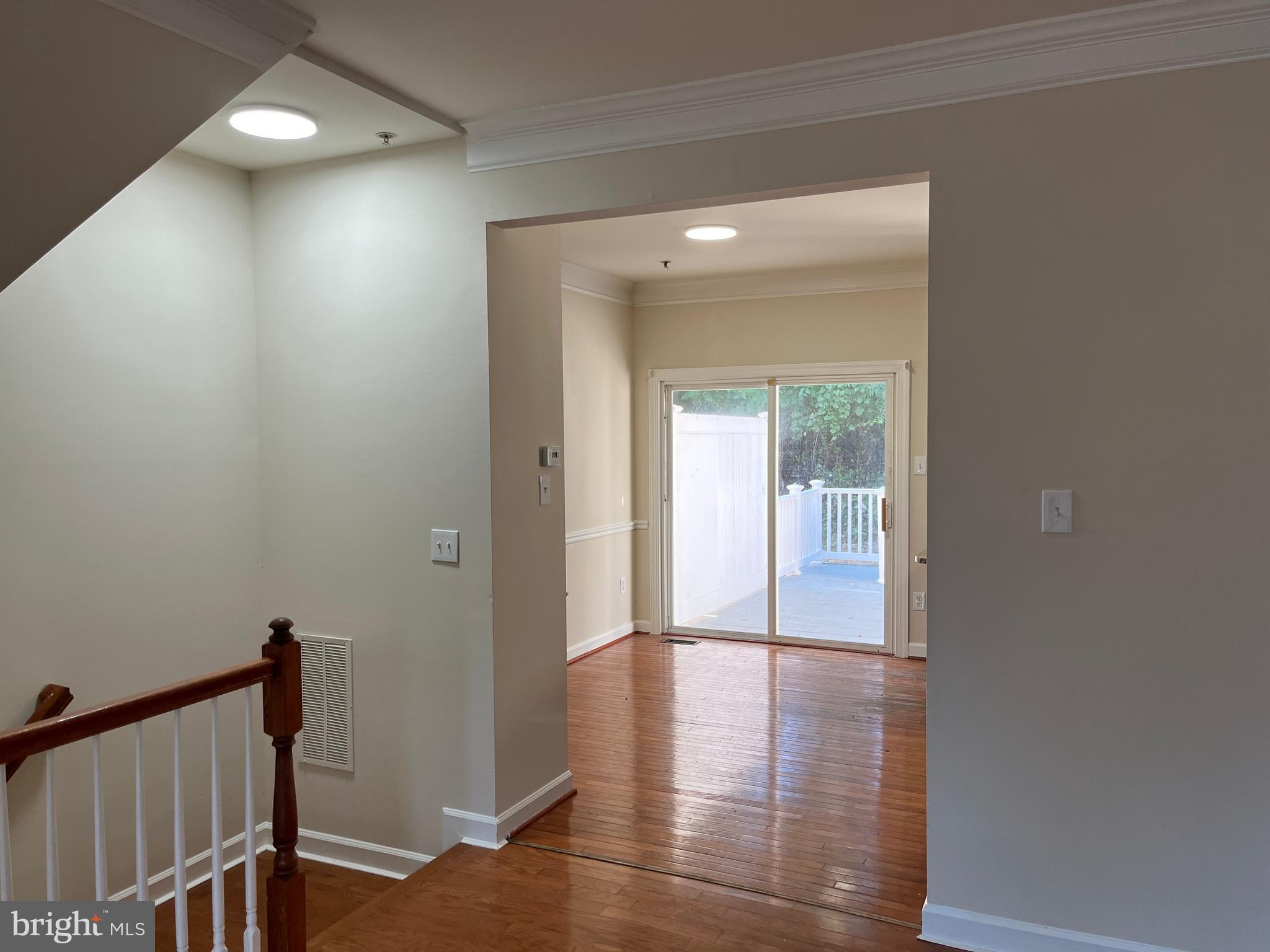 3316 Castle Ridge Circle, Unit 16 Silver Spring, MD 20904 - Photo 17 of 71 a view of a hallway with wooden floor