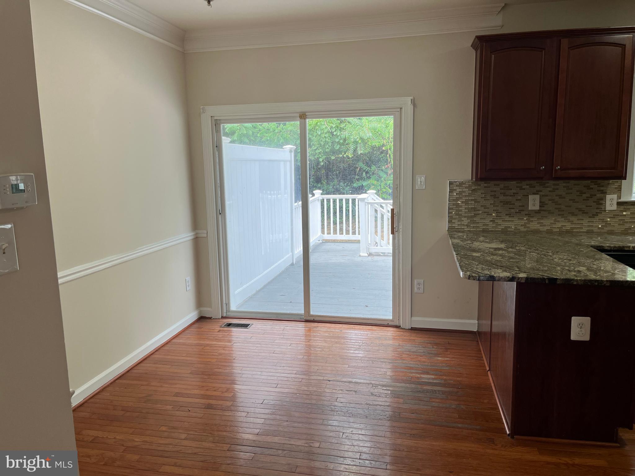 3316 Castle Ridge Circle, Unit 16 Silver Spring, MD 20904 - Photo 18 of 71 a view of a kitchen with wooden floor and a window