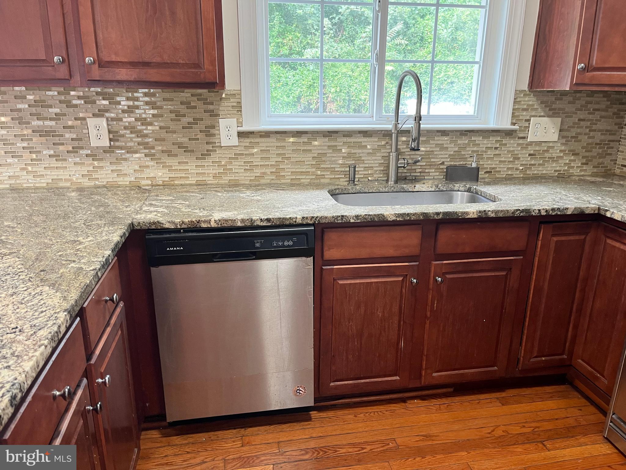 3316 Castle Ridge Circle, Unit 16 Silver Spring, MD 20904 - Photo 34 of 71 a kitchen with granite countertop cabinets and window