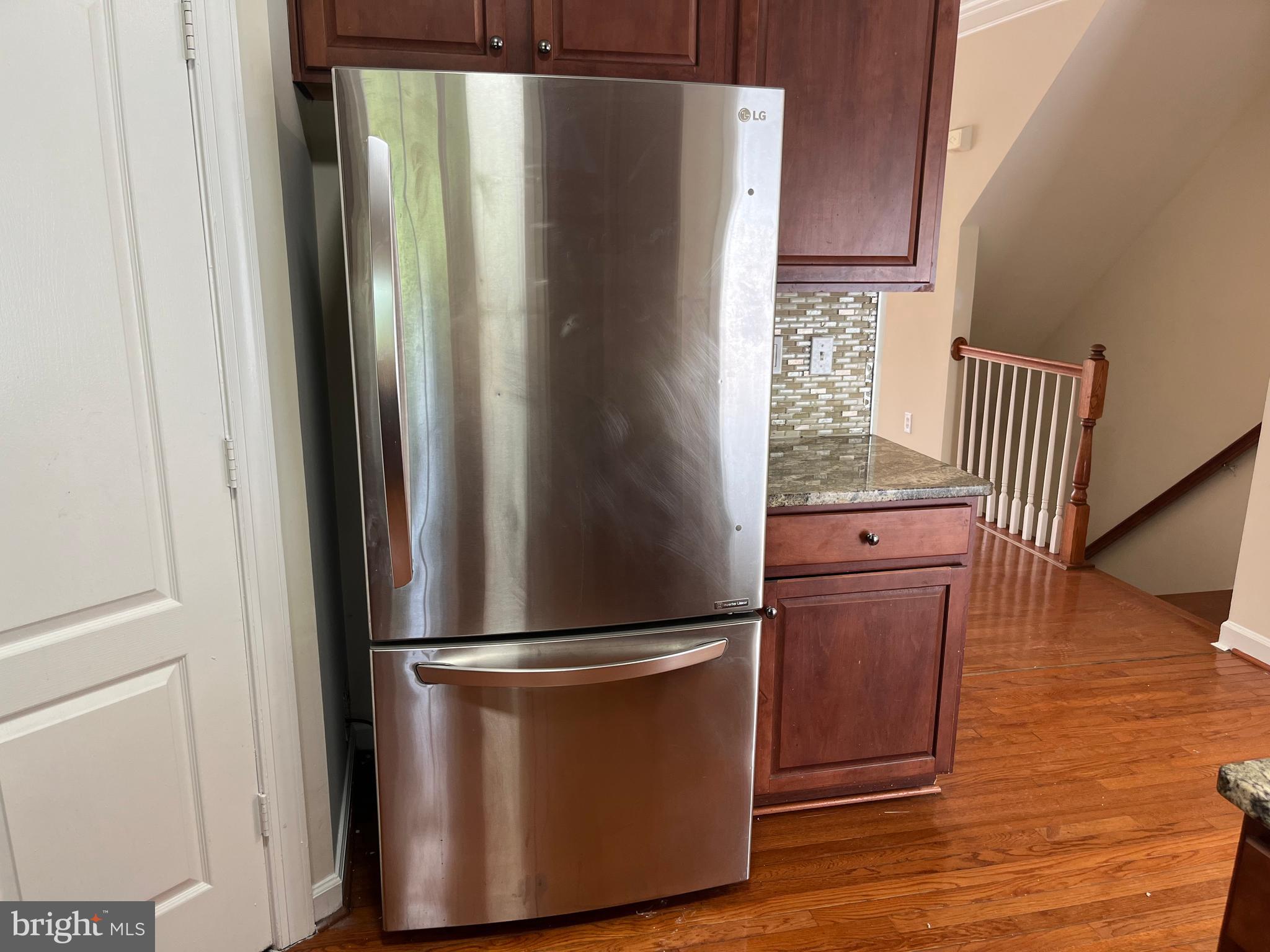 3316 Castle Ridge Circle, Unit 16 Silver Spring, MD 20904 - Photo 40 of 71 a refrigerator freezer sitting inside of a kitchen