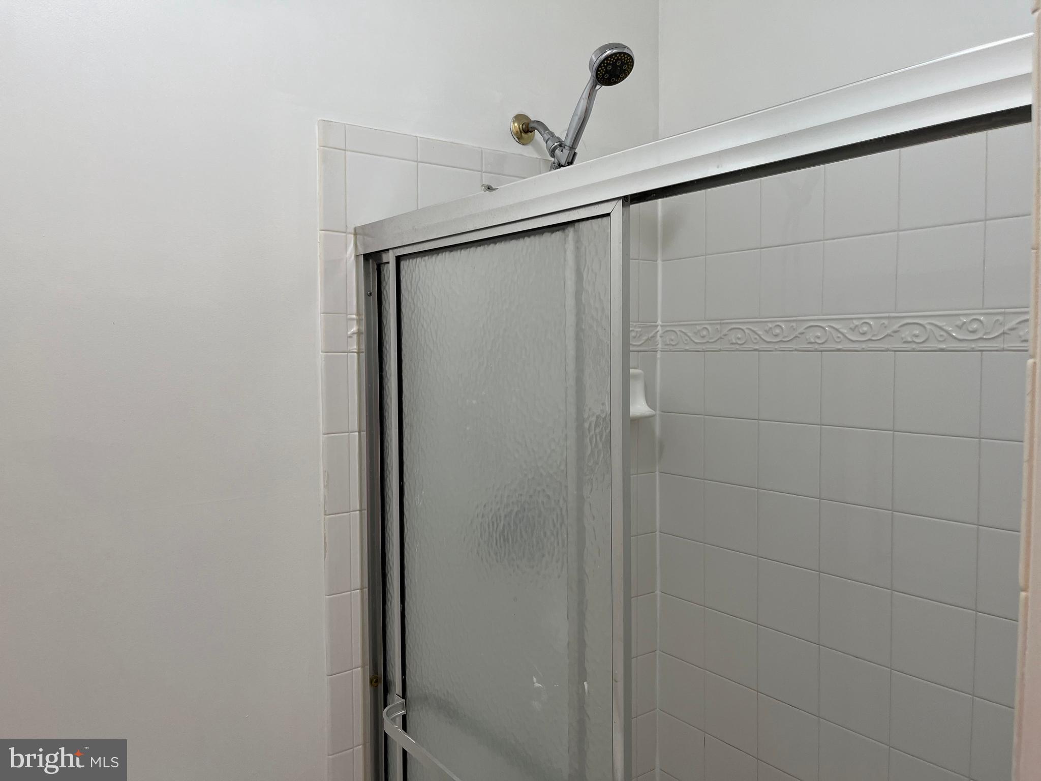 3316 Castle Ridge Circle, Unit 16 Silver Spring, MD 20904 - Photo 49 of 71 a bathroom with a shower and a sink