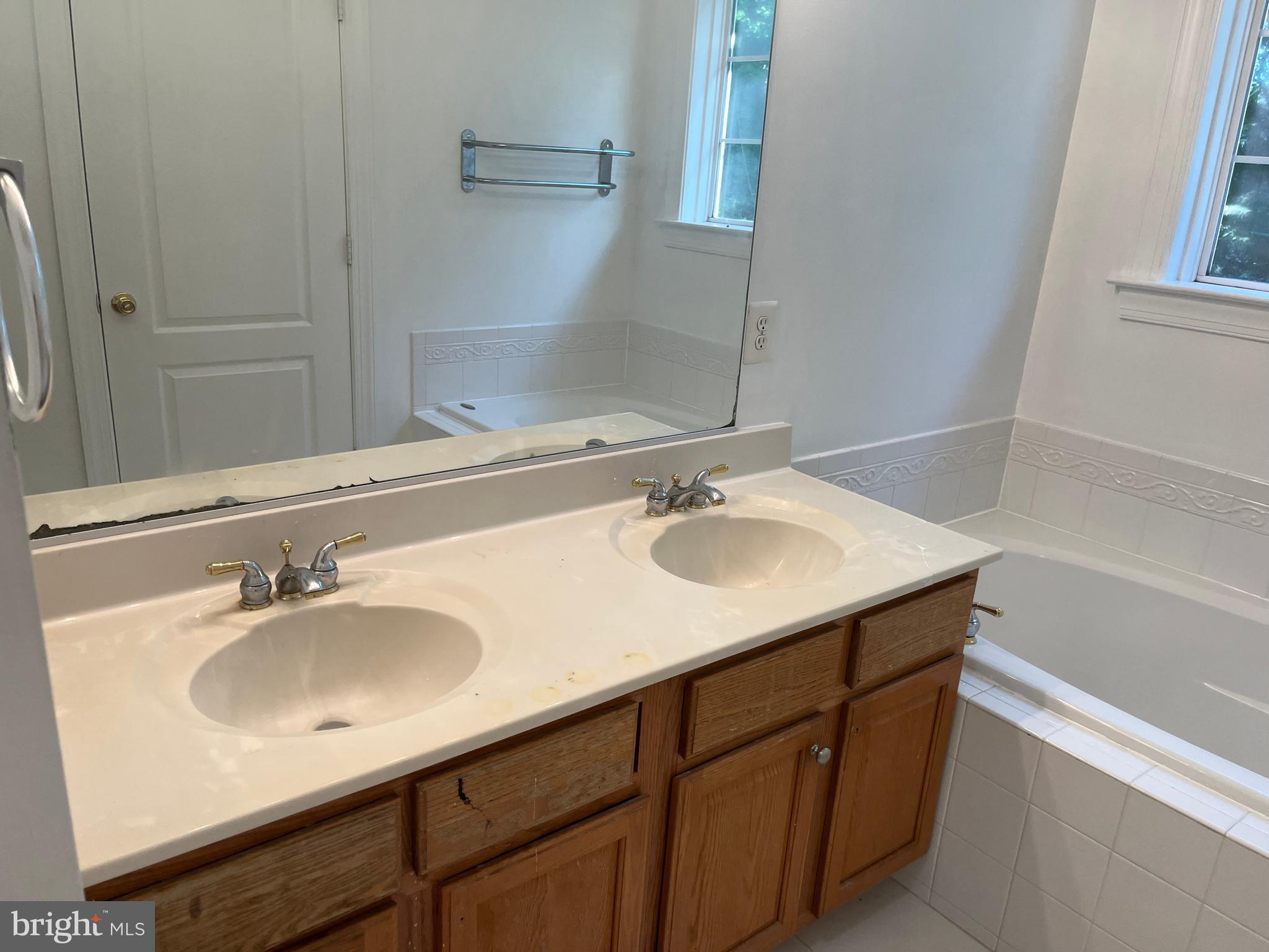 3316 Castle Ridge Circle, Unit 16 Silver Spring, MD 20904 - Photo 52 of 71 a bathroom with a sink and a mirror