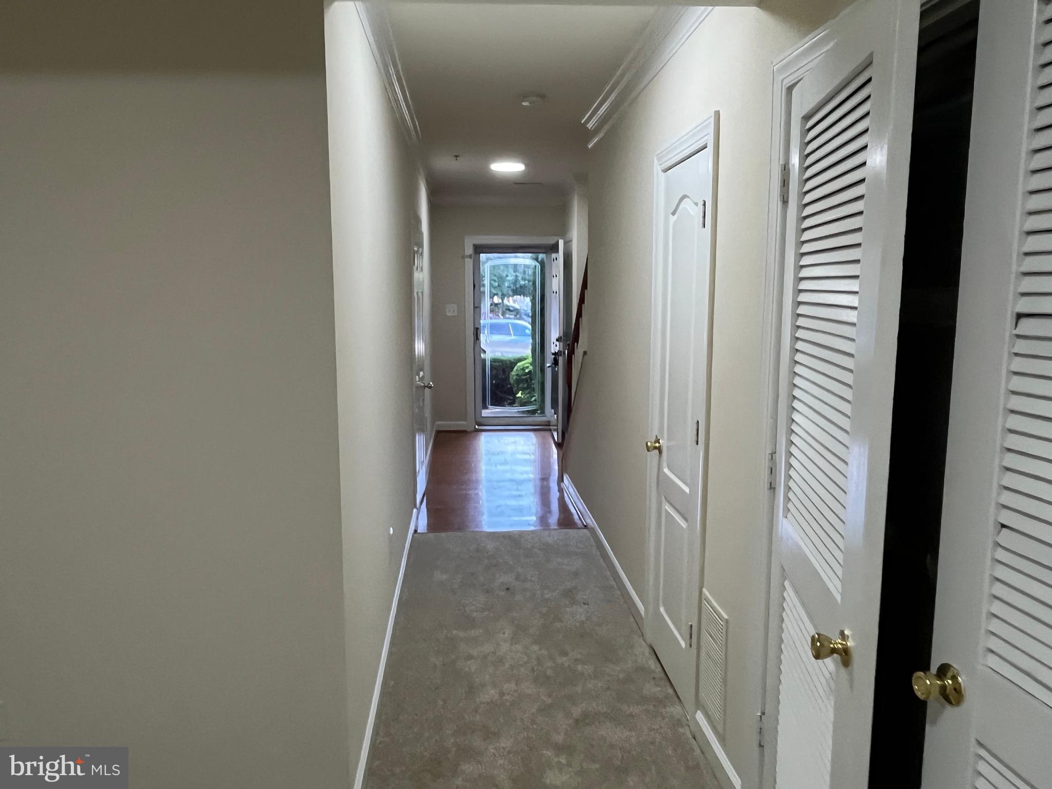 3316 Castle Ridge Circle, Unit 16 Silver Spring, MD 20904 - Photo 6 of 71 a view of a hallway with wooden floor