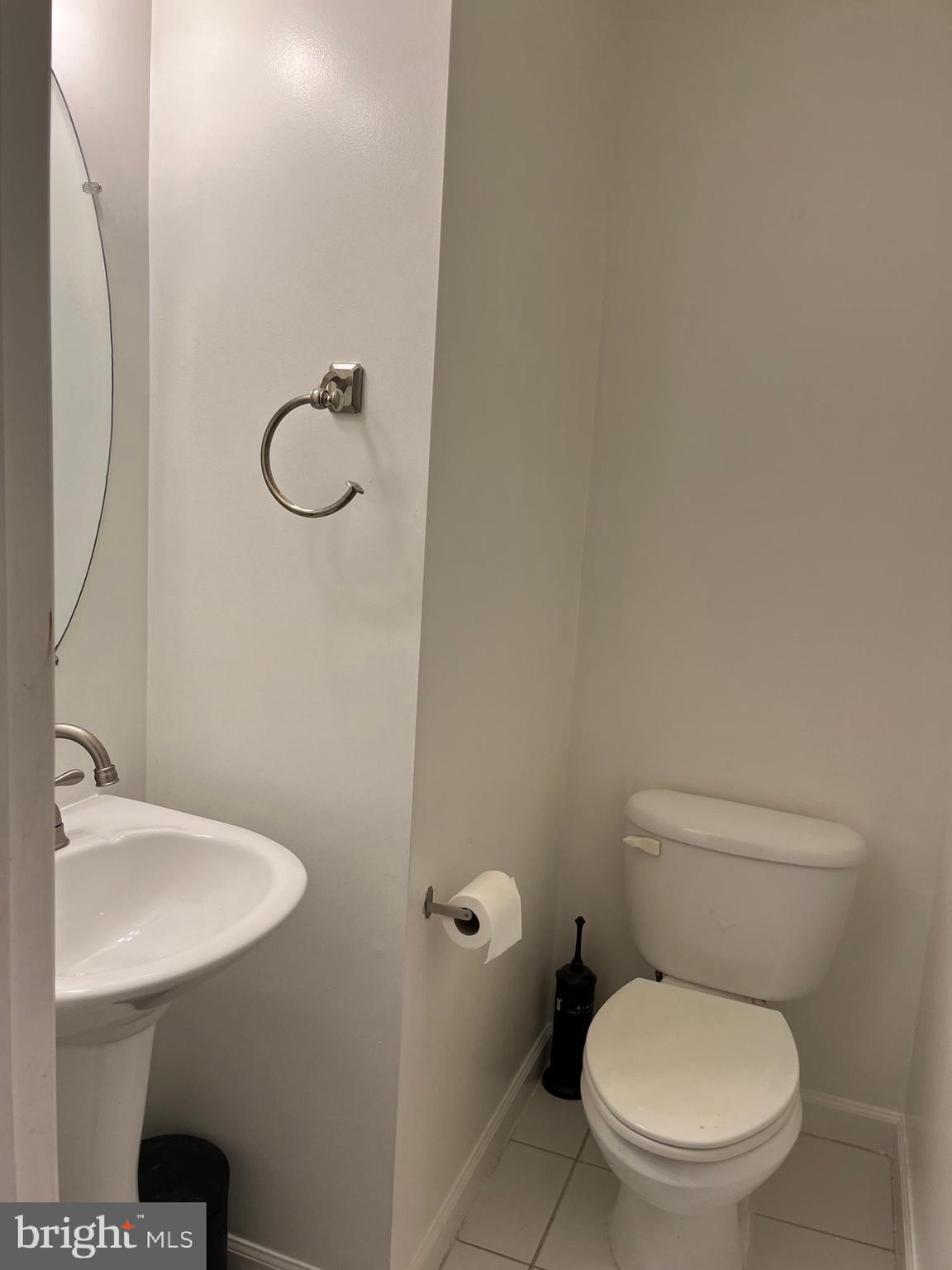 3316 Castle Ridge Circle, Unit 16 Silver Spring, MD 20904 - Photo 66 of 71 a bathroom with a toilet sink and mirror
