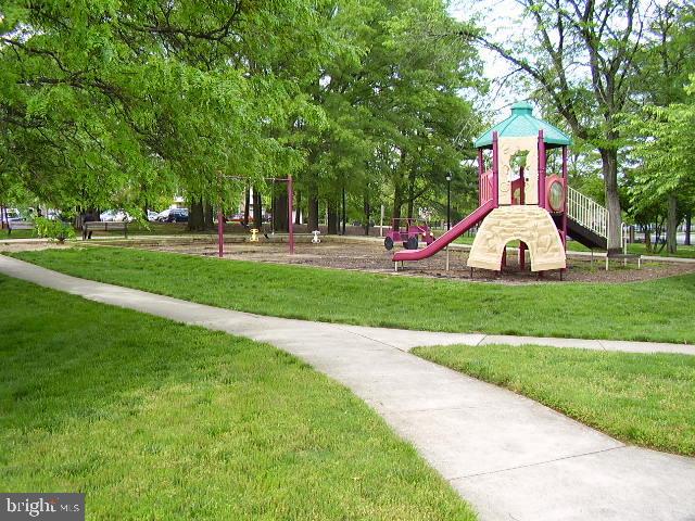 3316 Castle Ridge Circle, Unit 16 Silver Spring, MD 20904 - Photo 68 of 71 a view of a park with large trees and plants