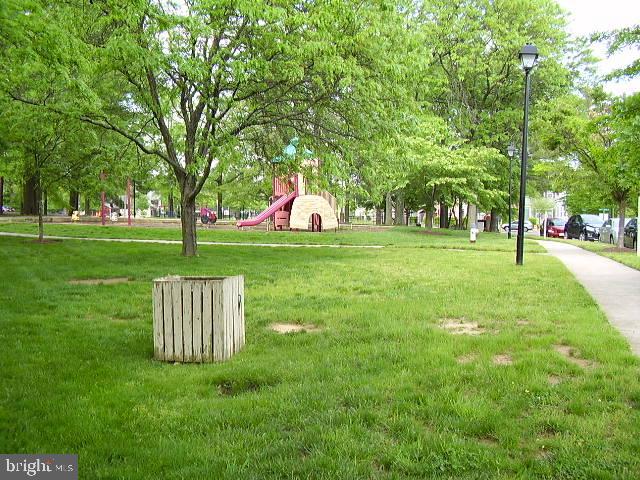 3316 Castle Ridge Circle, Unit 16 Silver Spring, MD 20904 - Photo 70 of 71 a view of a park with a bench and trees